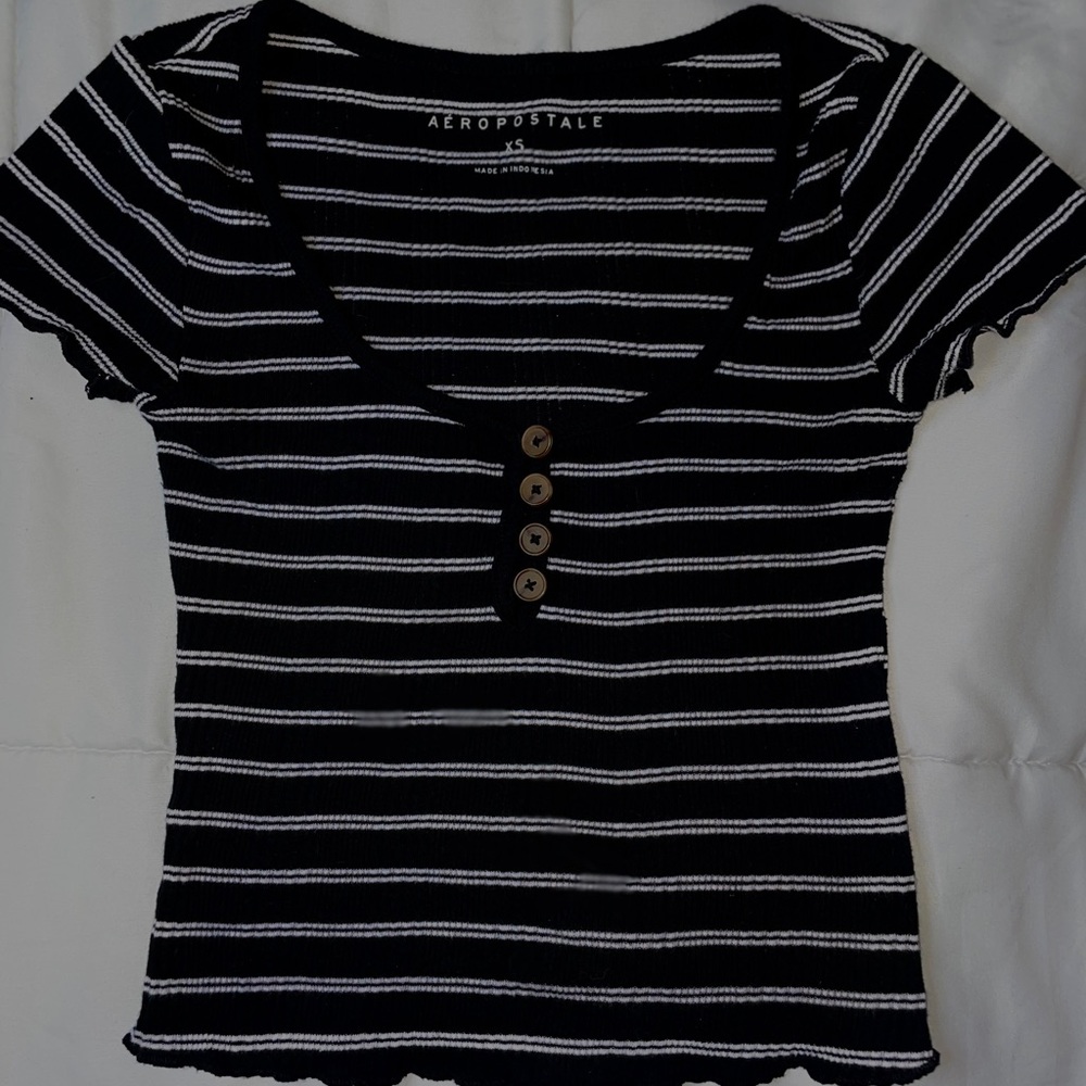White and black lined U neck shirt